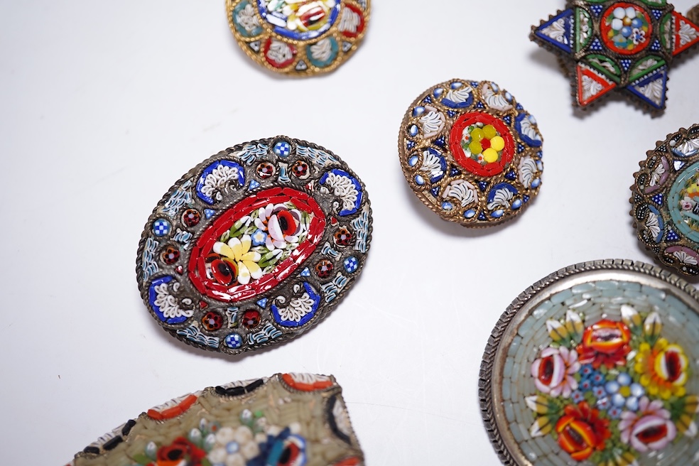 A collection of thirty-one micro-mosaic brooches, including fourteen mixed guitar and banjo shaped brooches, six large oval brooches and seven smaller brooches, three long brooches and a star shaped brooch. Condition - g